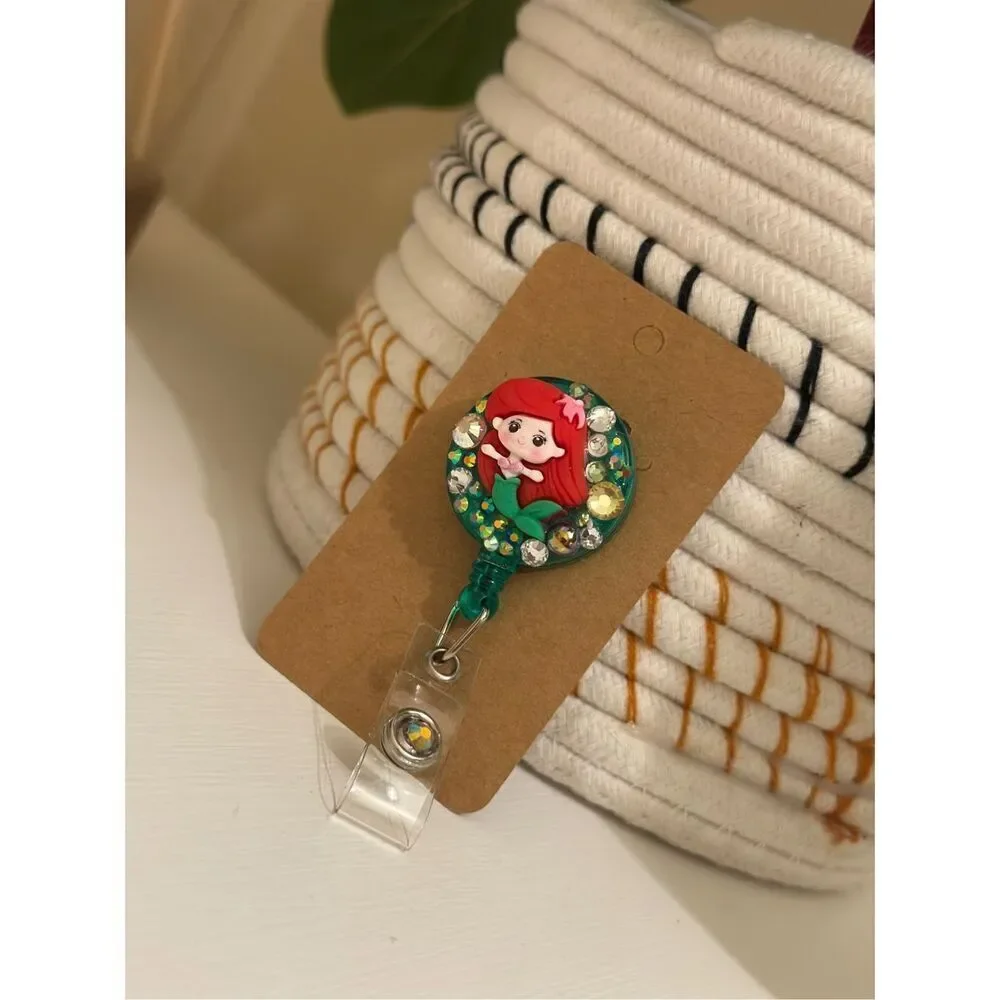 The Little Mermaid Ariel Rhinestone Red and Green Badge Reel